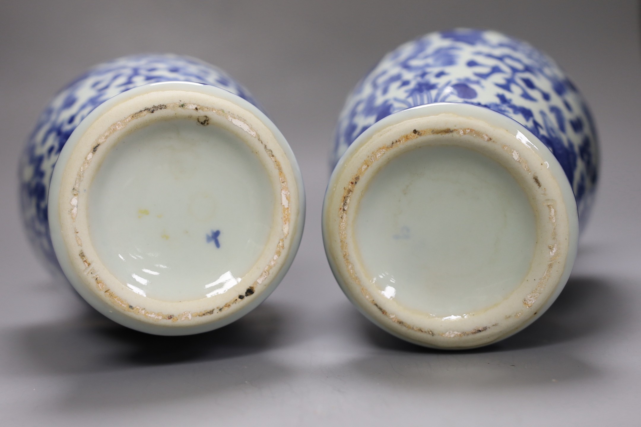 A pair of Chinese blue and white vases, two other vases and a moon flask, tallest 28cm